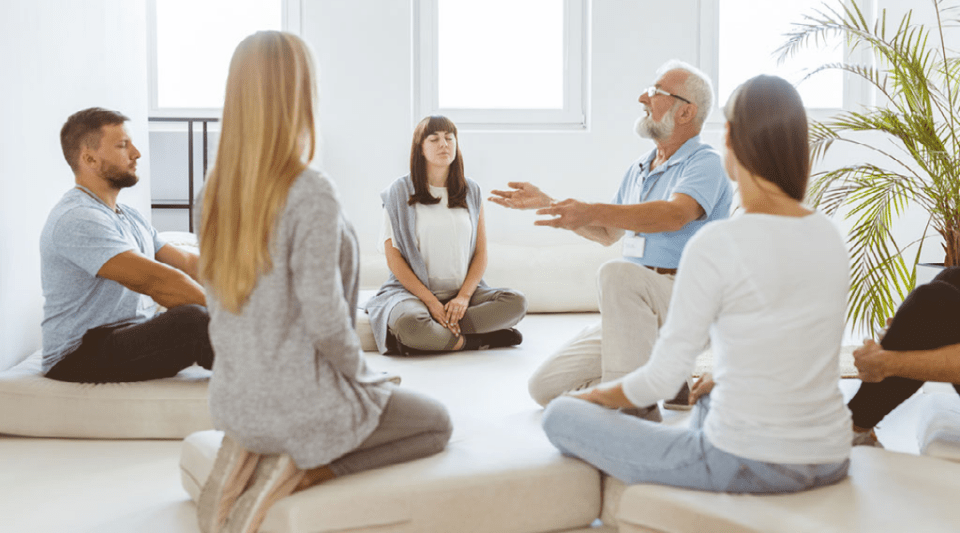 group of people practising mindfulness